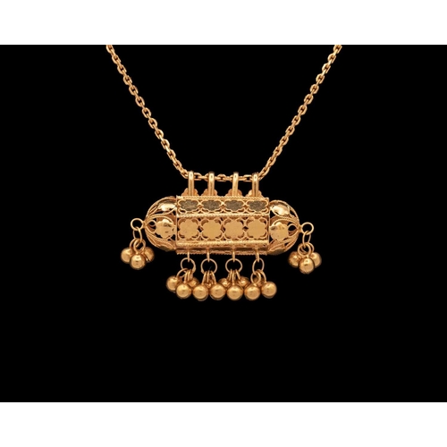 143 - An Indian high purity gold (acid tested) Dholna pendant necklace. The pendant stamped with makers ma... 