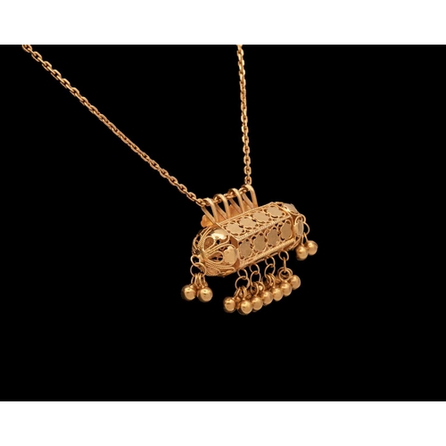 143 - An Indian high purity gold (acid tested) Dholna pendant necklace. The pendant stamped with makers ma... 