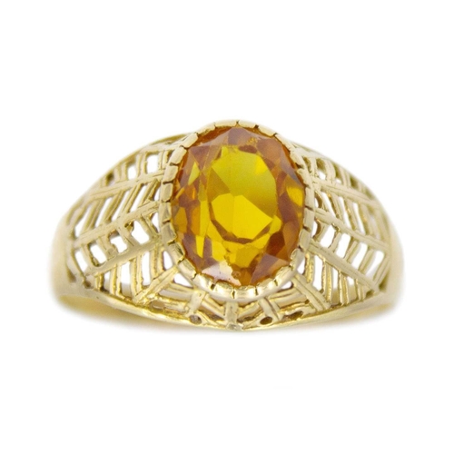 152 - An 18k gold synthetic yellow sapphire set ring. Stamped 750, the ring size Q, total weight 2.5g. Sli... 
