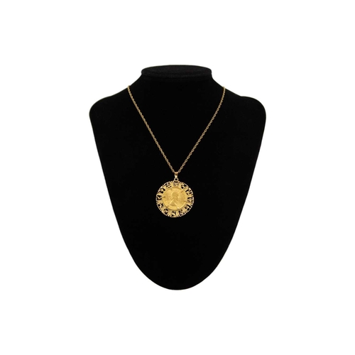 158 - A 1967 full sovereign gold coin 9k mounted zodiac pendant necklace. The sovereign in a cast pierced ... 