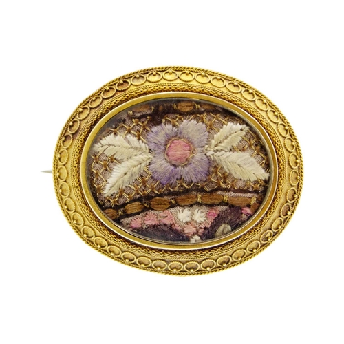 159 - A Victorian 14k gold (tested) Etruscan Revival oval locket brooch. The glazed panel front inset with... 