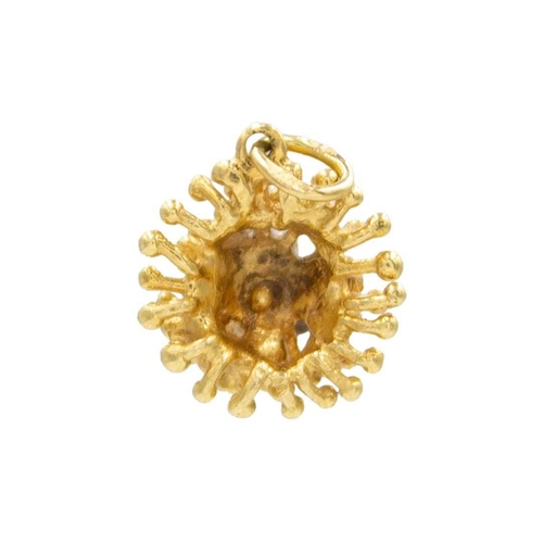 16 - An 18k gold pendant. Of a sea urchin design, diameter 12mm, stamped 750, weight 2.55g.