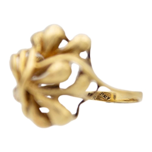 22 - An 18k sinuous design ring. Stamped 319AL 750, size M 1/2, 10.3g.
