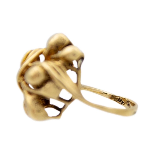 22 - An 18k sinuous design ring. Stamped 319AL 750, size M 1/2, 10.3g.