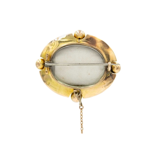 3 - A Victorian Etruscan revival high-purity gold brooch. The brooch has a locket back and a safety chai... 