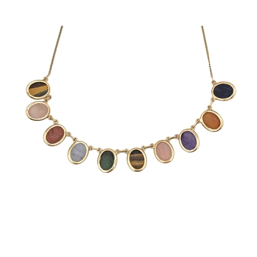31 - A 9k necklace set with ten various quartz oval cabochon gems. The ten stones each spectacle set and ... 