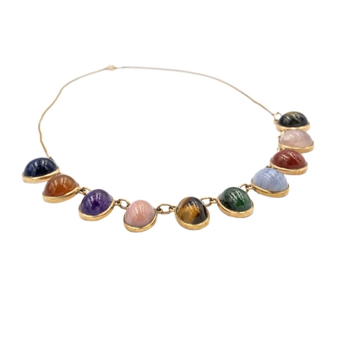 31 - A 9k necklace set with ten various quartz oval cabochon gems. The ten stones each spectacle set and ... 