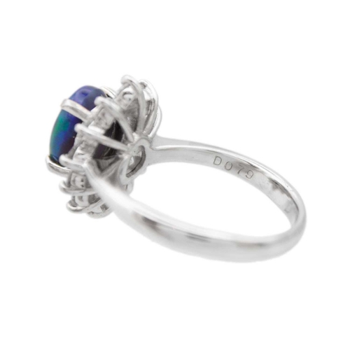 35 - A good black opal diamond ring, set in platinum. The oval-shaped cabochon opal is 9 x 7mm and depth ... 