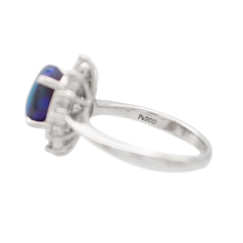 35 - A good black opal diamond ring, set in platinum. The oval-shaped cabochon opal is 9 x 7mm and depth ... 