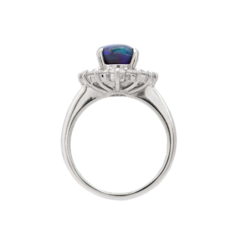 35 - A good black opal diamond ring, set in platinum. The oval-shaped cabochon opal is 9 x 7mm and depth ... 