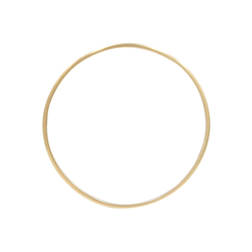 43 - A high-purity gold bangle bracelet. Unmarked, diameter 6.5cm, weight 16.25g. Tests 14k gold.