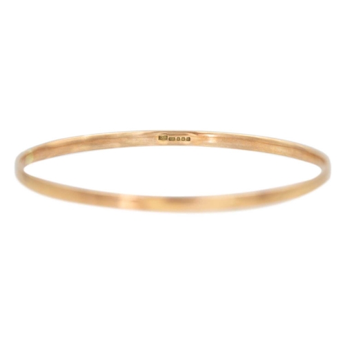 49 - A 9k rose gold bangle bracelet. Sheffield hallmark, diameter 7cm, weight 13.13g.