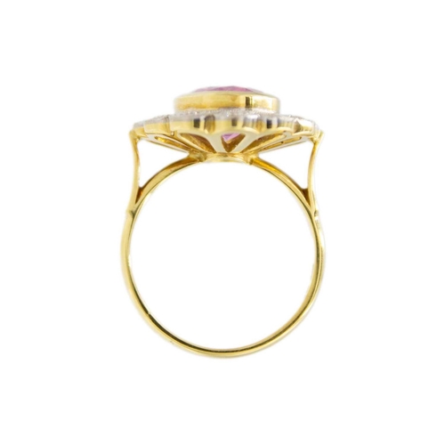 51 - A fine pink spinel and diamond ring. The spinel is 4.5ct approx., surrounded by twelve round brillia... 