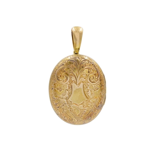 53 - A Victorian high purity gold locket pendant. Foliate scroll design, 5.3cm drop, 3cm x 3.8cm oval-sha... 