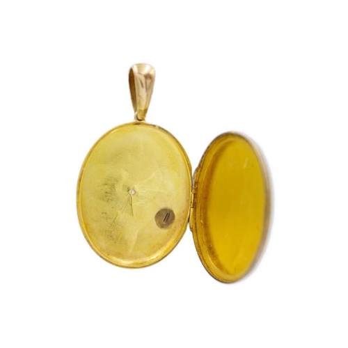 53 - A Victorian high purity gold locket pendant. Foliate scroll design, 5.3cm drop, 3cm x 3.8cm oval-sha... 