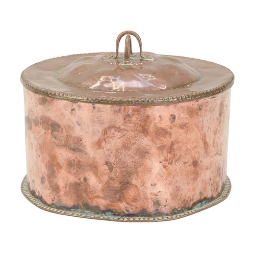 26 - John Pearson, a circular copper box and cover. The domed cover with a double loop knop and planished... 