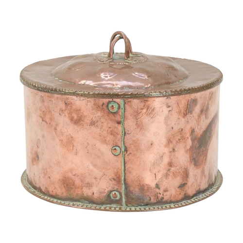 26 - John Pearson, a circular copper box and cover. The domed cover with a double loop knop and planished... 