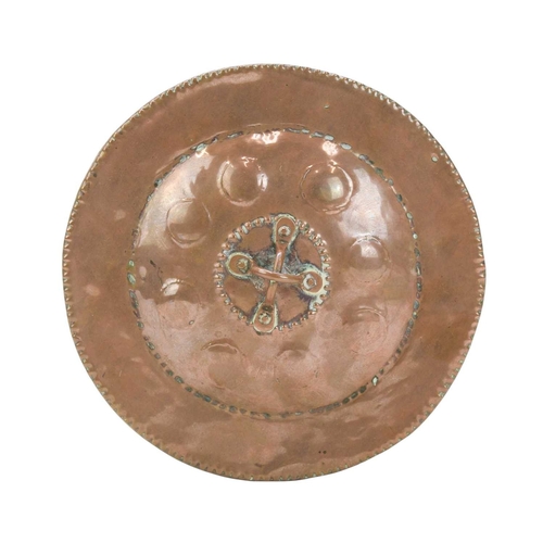 26 - John Pearson, a circular copper box and cover. The domed cover with a double loop knop and planished... 