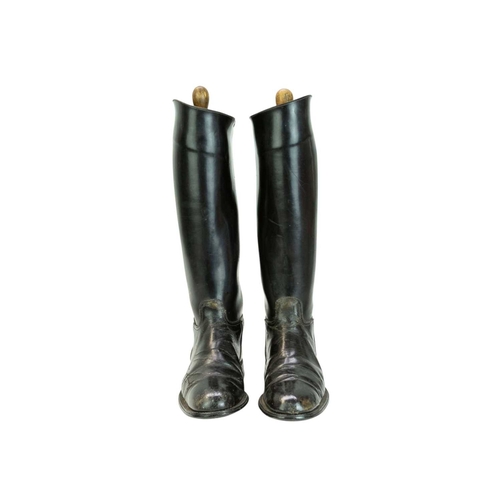 31 - A pair of black leather riding boots and trees. Size 7 1/2