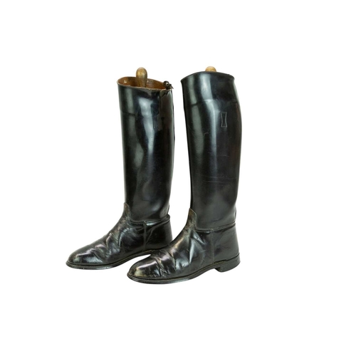 31 - A pair of black leather riding boots and trees. Size 7 1/2