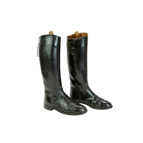 31 - A pair of black leather riding boots and trees. Size 7 1/2