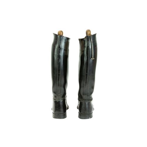 31 - A pair of black leather riding boots and trees. Size 7 1/2
