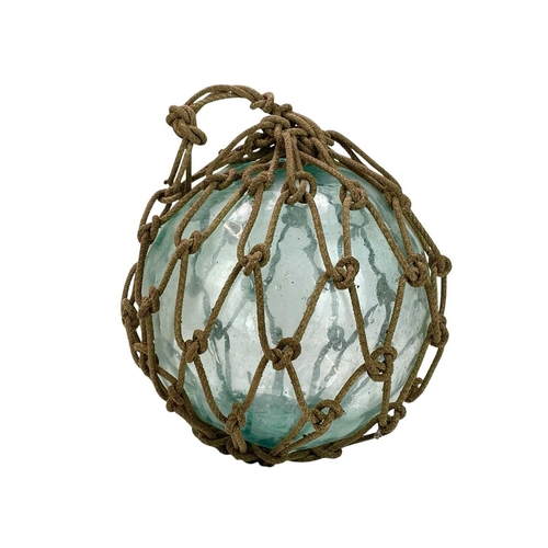 33 - Three large blown glass fishing floats. In varying green and blue tones, still with their original r... 