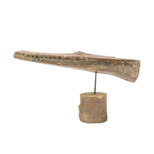 43 - A carved hardwood crocodile canoe prow. Papua New Guinea, length 49cm, on a later stand.