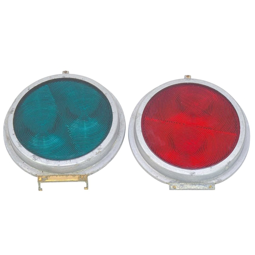 50 - Two glass railway reflector lenses. Red and green, in aluminium frames, diameter 20cm (2). The glass... 