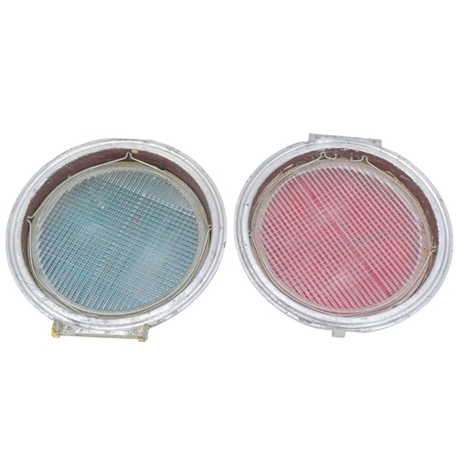 50 - Two glass railway reflector lenses. Red and green, in aluminium frames, diameter 20cm (2). The glass... 