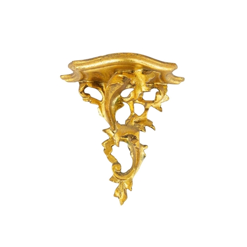 53 - Three Italian carved gilt wood wall brackets. 20th century, in the Florentine style, with rococo car... 