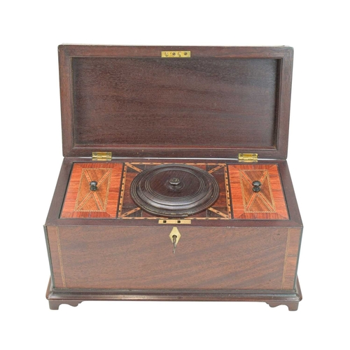 55 - A George III mahogany and inlaid tea caddy. The chequer strung lid with central flower urn inlay, in... 