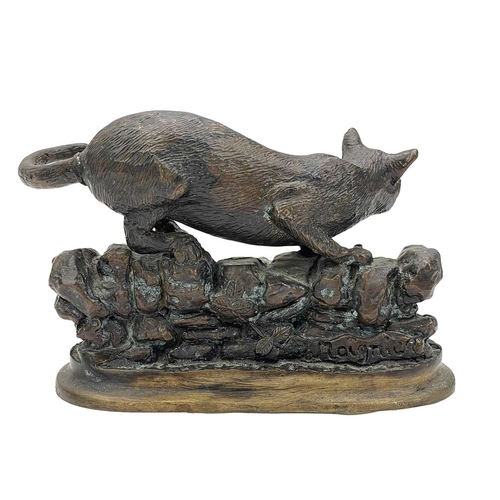 7 - After Jules Moigniez, a small bronze feline figure. 20th century, modelled on a rocky wall, height 9... 