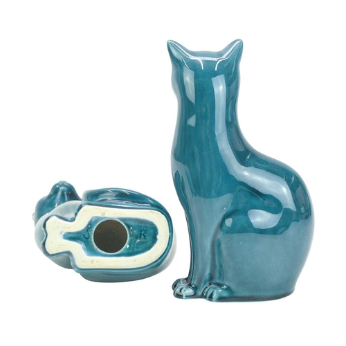 713 - A pair of mid century Poole pottery cats. Teal glaze, both stamped 'Poole England' to the base, heig... 