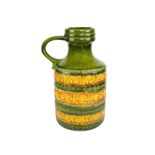 715 - A graduated pair of West German vases. Green and ochre glaze, each with a side handle and impressed ... 