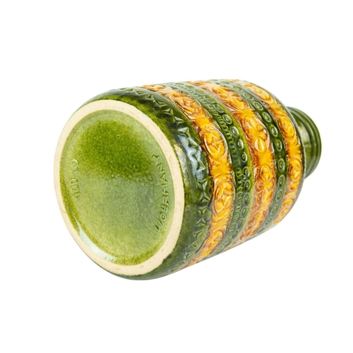 715 - A graduated pair of West German vases. Green and ochre glaze, each with a side handle and impressed ... 