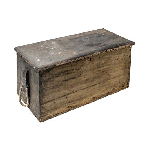 A Victorian pine sea chest. With canted sides, fitted with rope handles ...