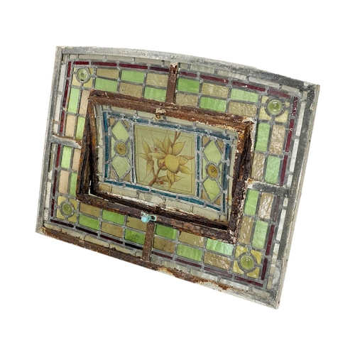 117 - A collection of leaded stained glass panels. Late 19th century in need of restoration, various shape... 