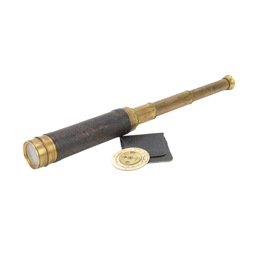 122 - A brass three draw telescope. Circa 1900, with leather covered outer tube, 60cm (extended), together... 