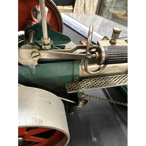 162 - An early Mamod TE1 steam traction engine. With red paint work, together with a Mamod steam roller, a... 