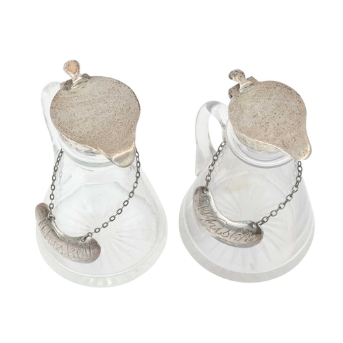 192 - Two silver mounted cut glass whisky noggins. The hinged covers marked for Chester, 1911, and London,... 