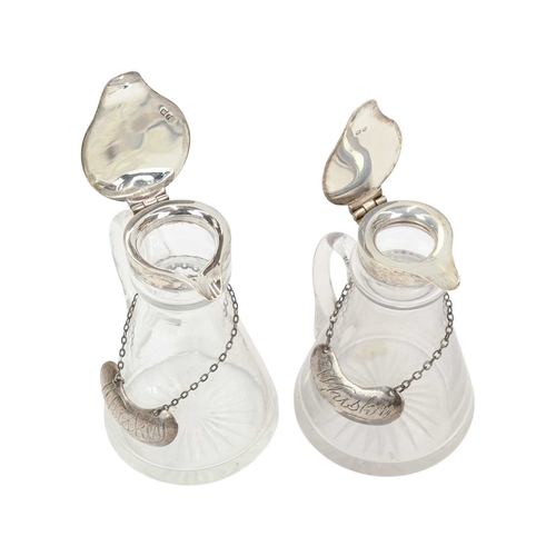 192 - Two silver mounted cut glass whisky noggins. The hinged covers marked for Chester, 1911, and London,... 