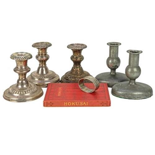 195 - Three loaded silver piano candlesticks. Mixed dates and makers, height 11cm, together with a silver ... 