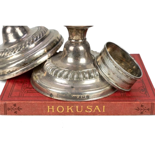 195 - Three loaded silver piano candlesticks. Mixed dates and makers, height 11cm, together with a silver ... 