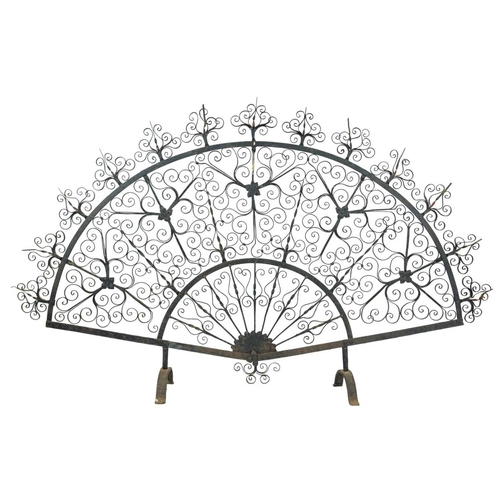 204 - An ornate wrought iron fire screen, attributed to Archibald Carne of Truro. Of ornate fan shape, hei... 
