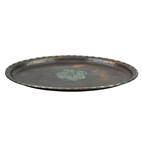 207 - A Hugh Wallis copper and inlaid tray. With central pewter inlaid vine and grape decoration and chequ... 
