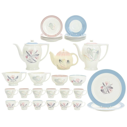 229 - A large collection of Susie Cooper ceramics. In various designs including 'Day Lily', 'Gardenia', 'S... 