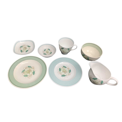 229 - A large collection of Susie Cooper ceramics. In various designs including 'Day Lily', 'Gardenia', 'S... 