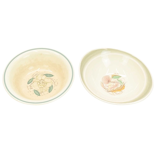 229 - A large collection of Susie Cooper ceramics. In various designs including 'Day Lily', 'Gardenia', 'S... 