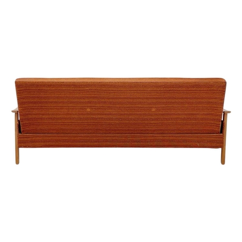232 - A mid-century sofa bed. With stained beech framed arms and feet, height 79cm, width 193cm, depth 74c... 